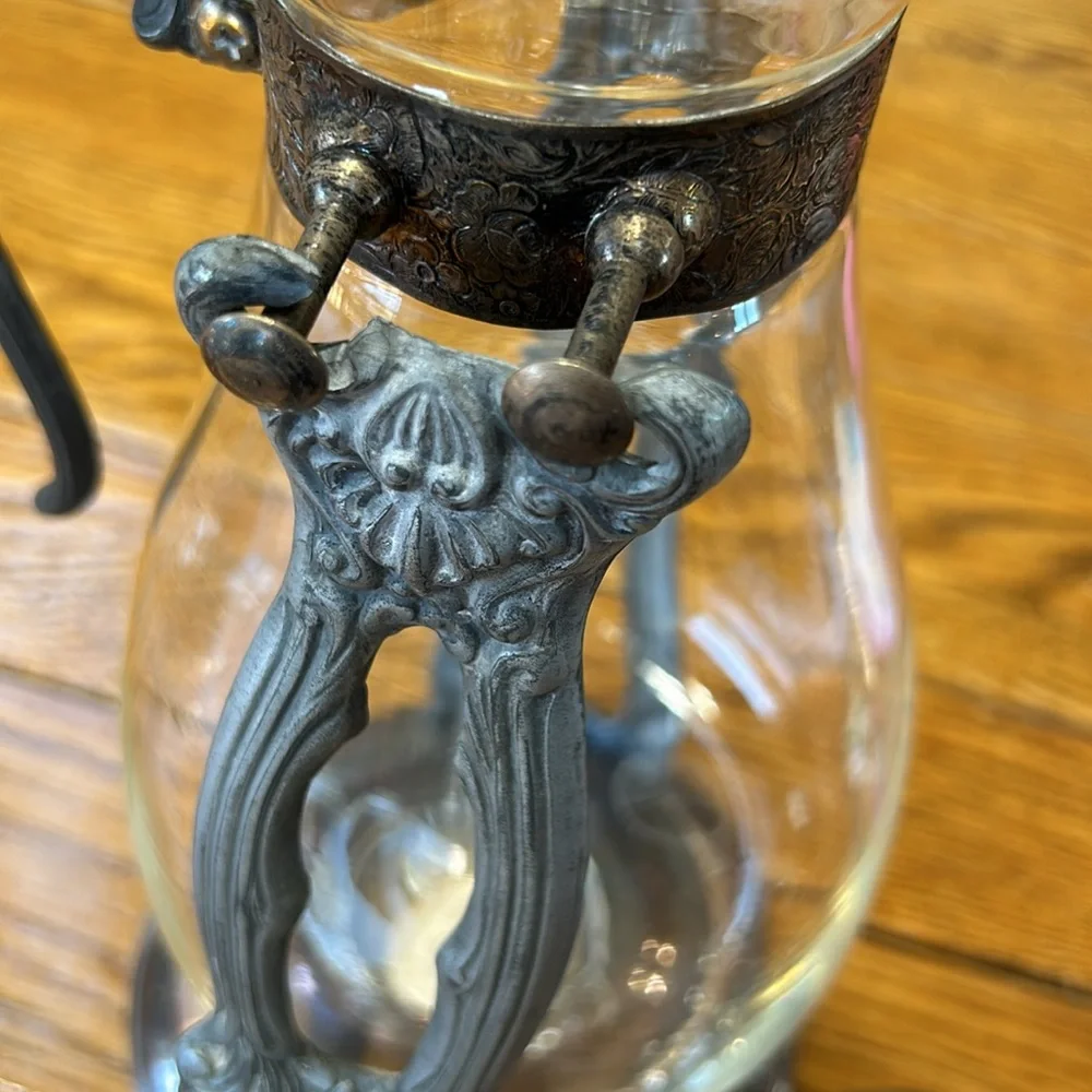 Vintage silver plated tilting coffee stand and carafe. No markings. Glass carafe